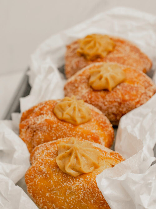 homemade pumpkin pie donuts in a row