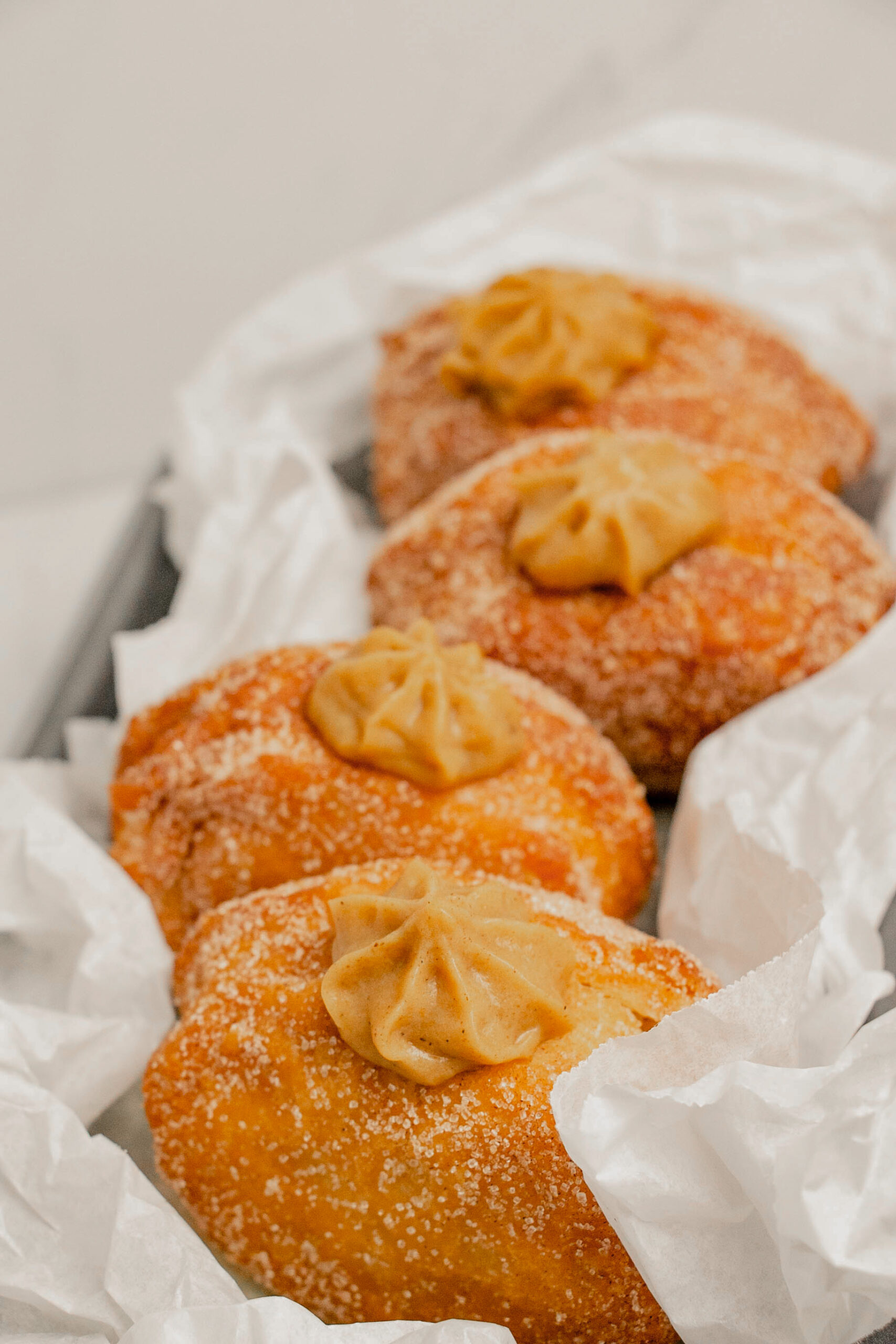 homemade pumpkin pie donuts in a row