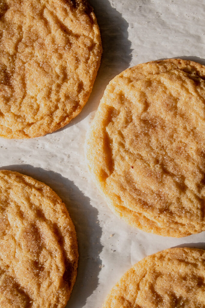 homemade jumbo snickerdoodle cookies on a tray from above