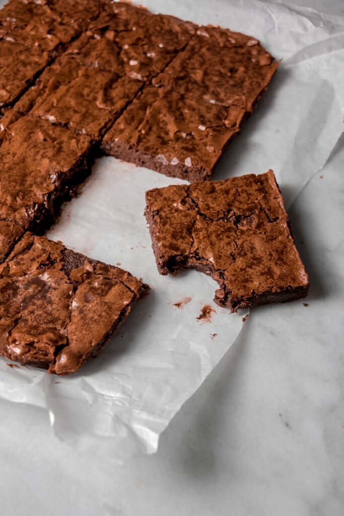 homemade brownies side view with a bite taken