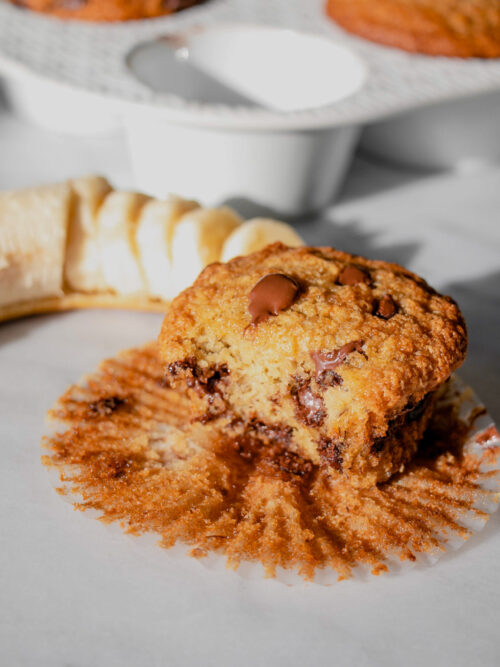 homemade banana chocolate chip muffin with a bite