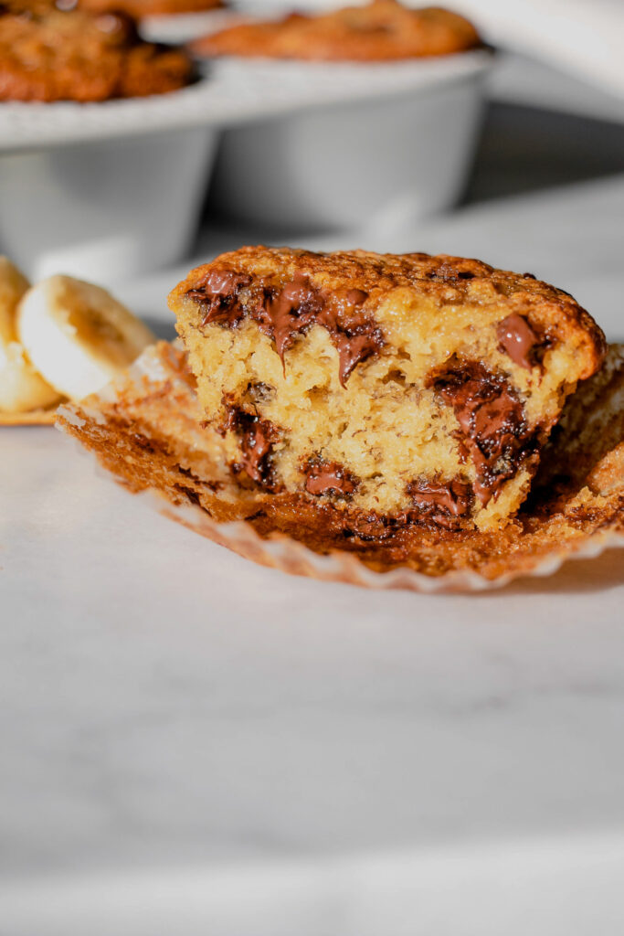 homemade banana chocolate chip muffin cut in half