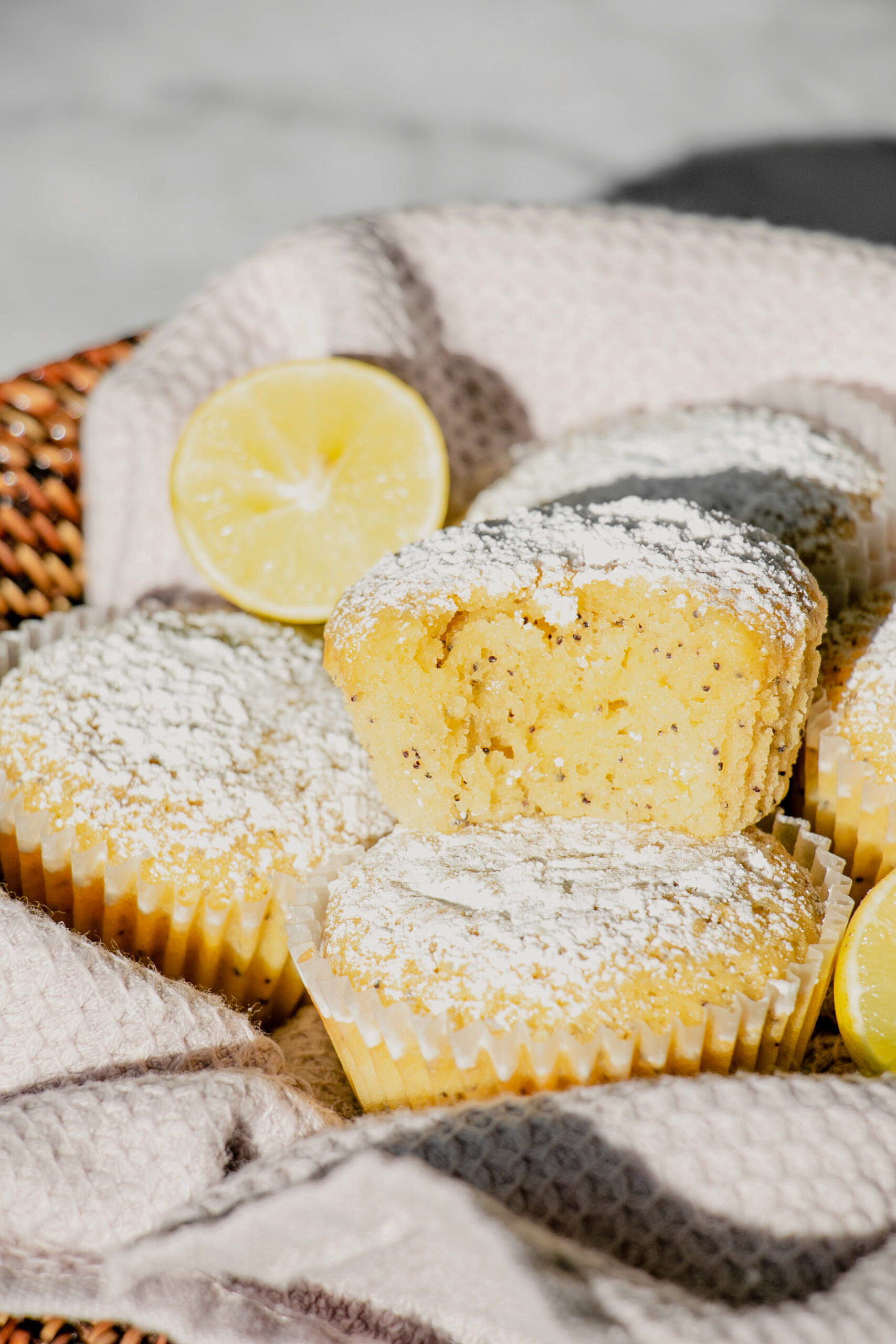 homemade lemon poppy seed muffins with a bite