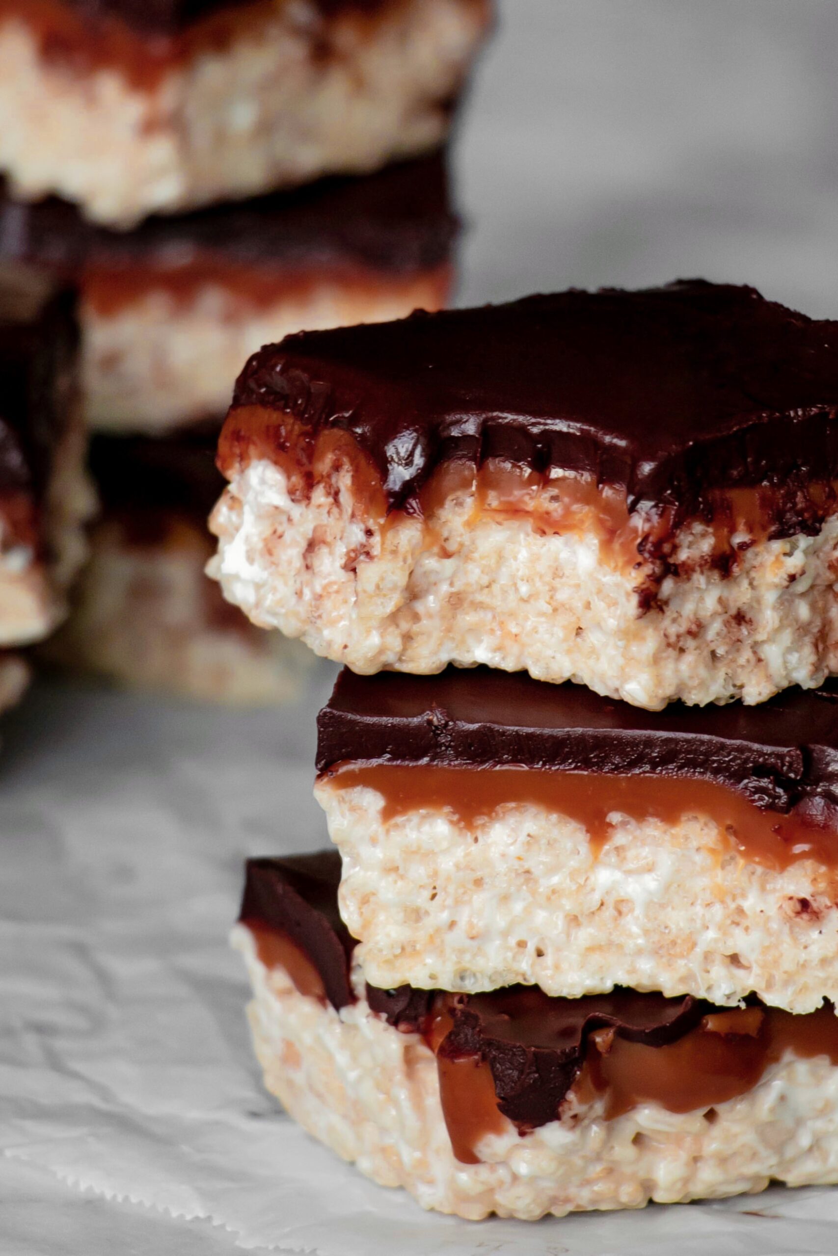 Homemade Rice Krispie Treats with chocolate and caramel stacked