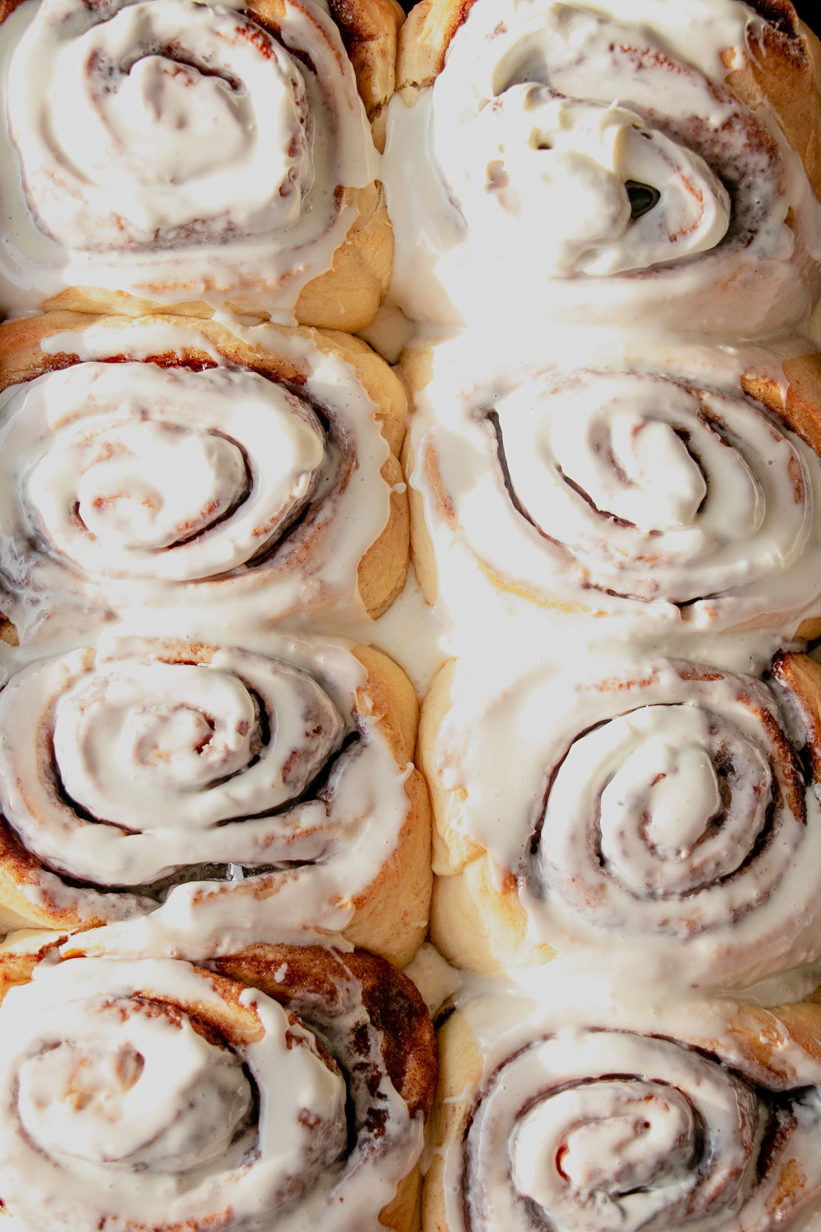 homemade cinnamon rolls frosted top view