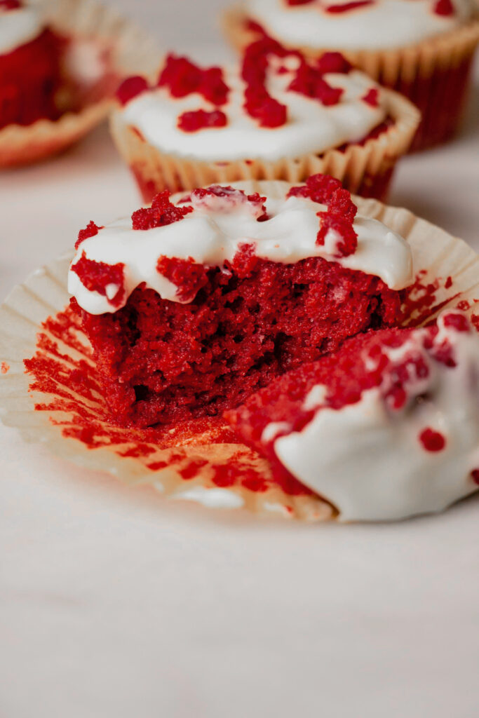 homemade red velvet cupcakes cut in half